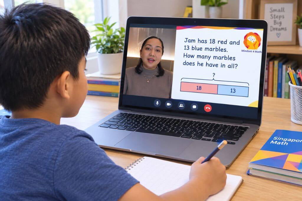 A child works through a Singapore math online tutorial on a laptop while writing in a notebook, with a teacher explaining a bar model for a marble addition problem. The screen reads "Jam has 18 red and 13 blue marbles. How many marbles does he have in all?" and shows bar model sections labeled "18" and "13".